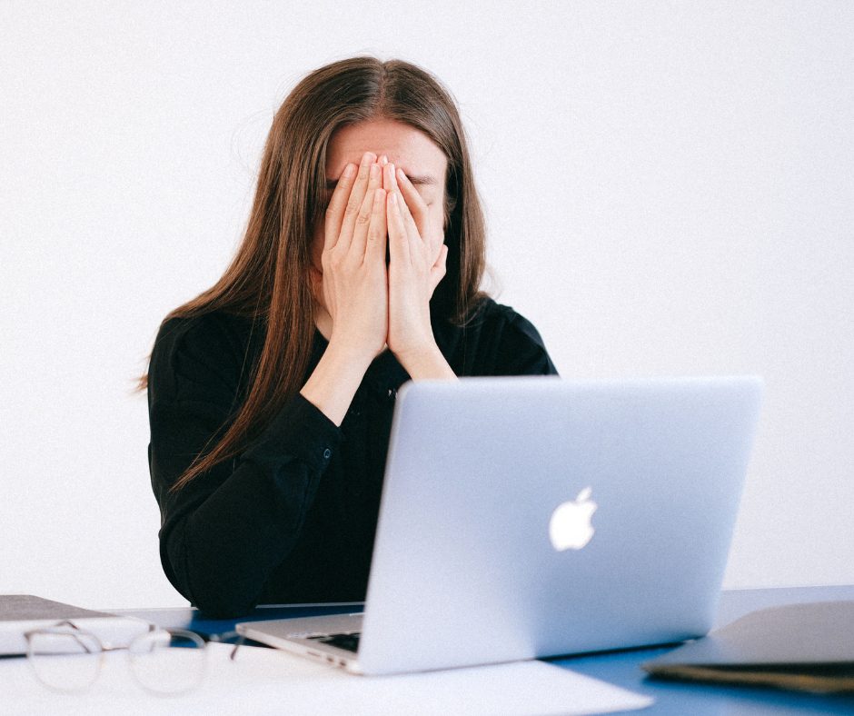 overwhelmed woman at computer